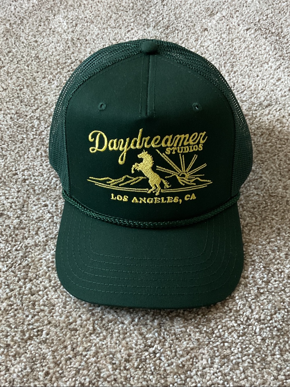 Daydreamer Forest Green Trucker Hat with Yellow Embroidered Logo